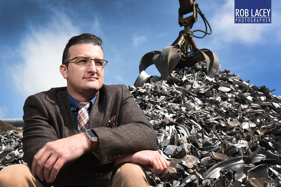 Steven Munnock CEO Avon Metals with pile of scrap precious metal 