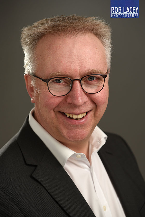 Linkedin headshot dark grey background