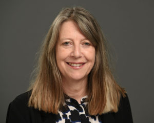 Female headshot on grey background