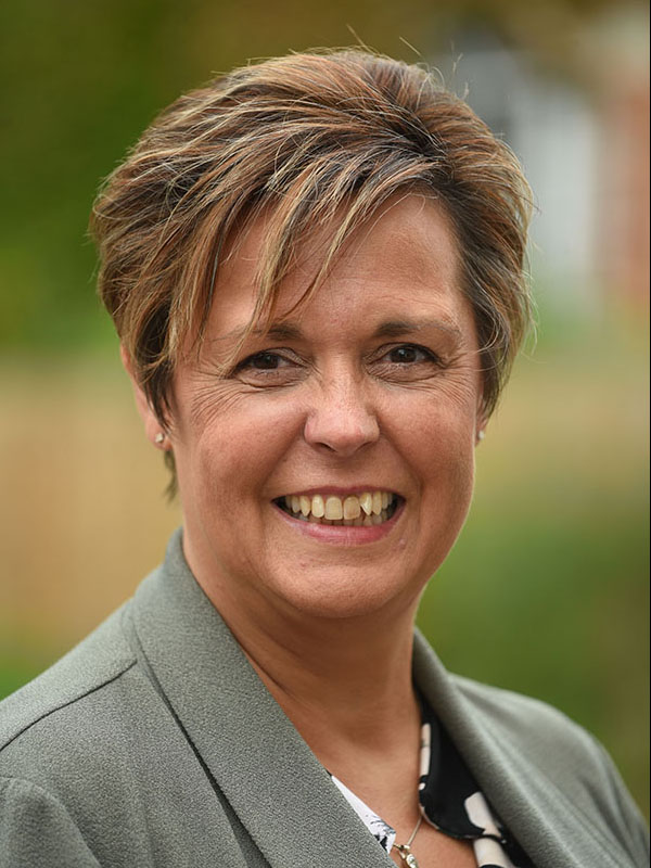 headshot on blurry background