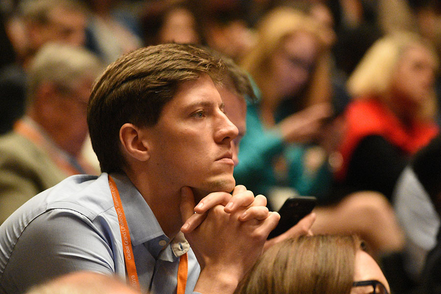 listening to conference speakers