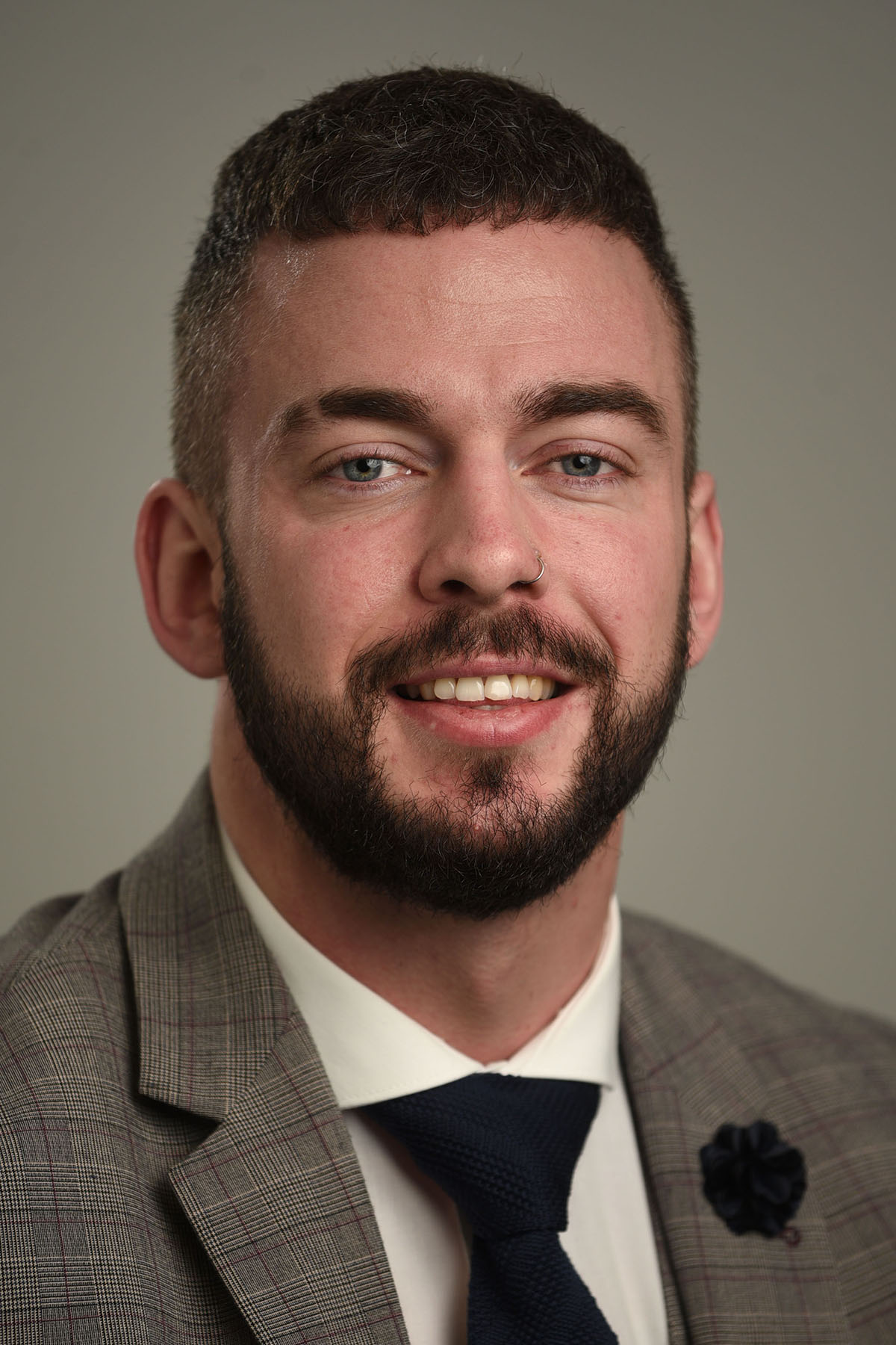 male headshot grey background